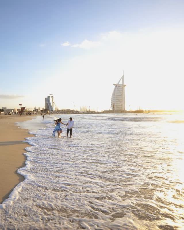 People walking along the beach in Dubai