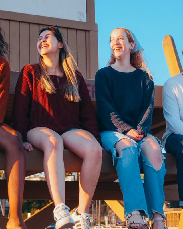 Friends on a lifeguard tower at the beach