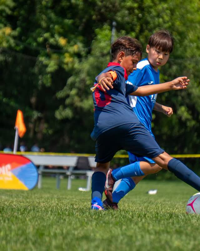 Kids playing football in a New York park