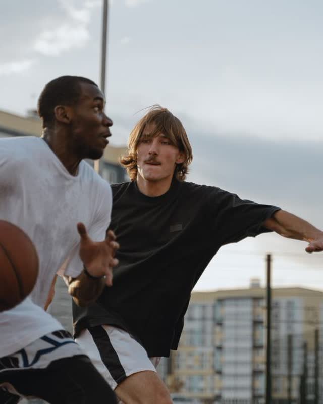 Friends playing pickup basketball